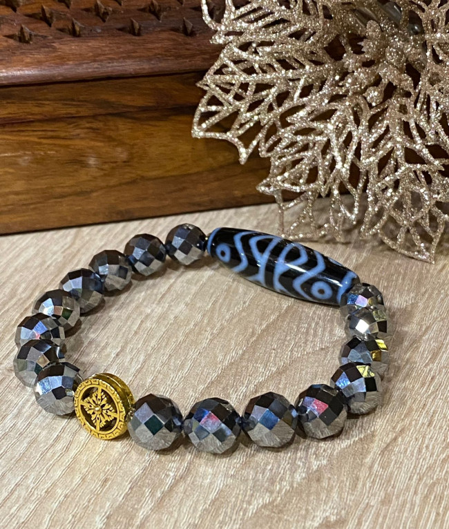 Бусина Дзи "Дхарма" в браслете из граненого гематита с ваджрой Бусина Дзи "Дхарма" в браслете из граненого гематита с ваджрой