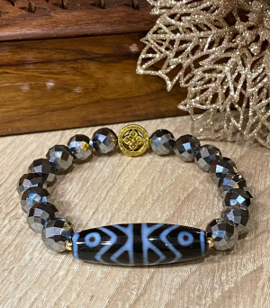 Бусина Дзи "Дхарма" в браслете из граненого гематита с ваджрой