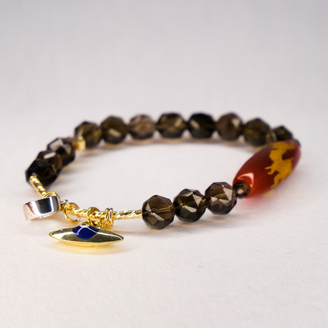 Бусина Дзи Дракон в браслете из граненого раухтопаза Бусина Дзи Дракон в браслете из граненого раухтопаза