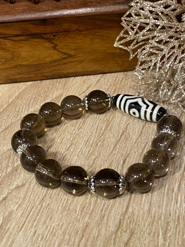 Бусина Дзи 3 глаза в браслете из раухтопаза