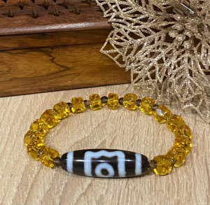 Бусина Дзи 3 глаза в браслете из граненых цитрина и раухтопаза