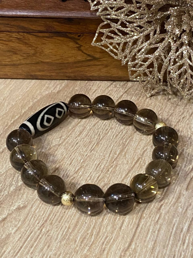 Бусина Дзи " Два сердца Будды" в браслете из раухтопаза Бусина Дзи " Два сердца Будды" в браслете из раухтопаза