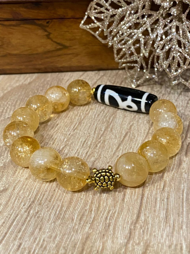 Бусина Дзи "Бог Богатства" в браслете из золотого цитрина