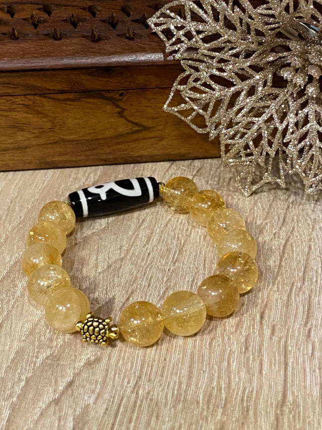 Бусина Дзи "Бог Богатства" в браслете из золотого цитрина