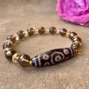 Бусина Дзи 11 глаз в браслете из раухтопаза и цитрина в огранке