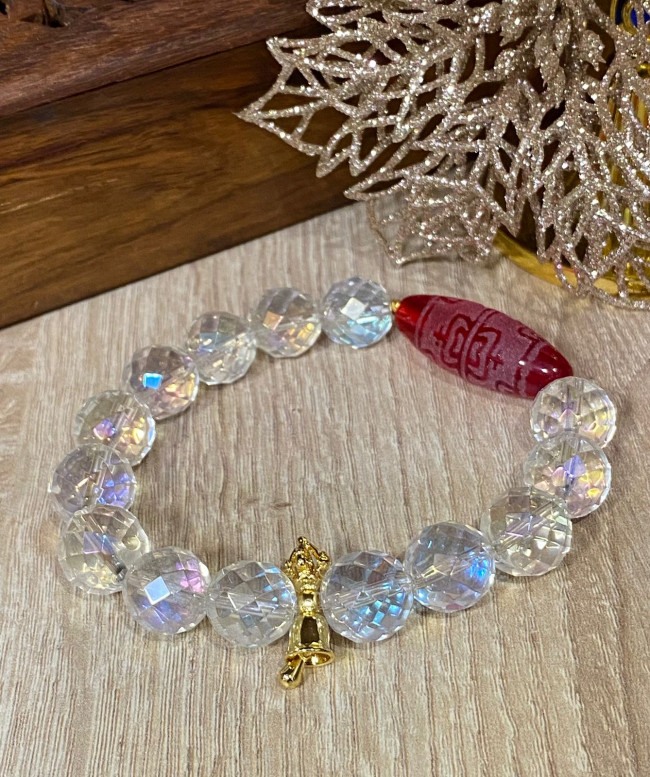 Бусина Дзи "8 нектарных сосудов" в браслете из граненного горного хрусталя с колокольчиком ваджра Бусина Дзи "8 нектарных сосудов" в браслете из граненного горного хрусталя с колокольчиком ваджра