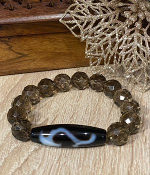 Бусина Дзи " Жезл Руйи" в браслете из раухтопаза