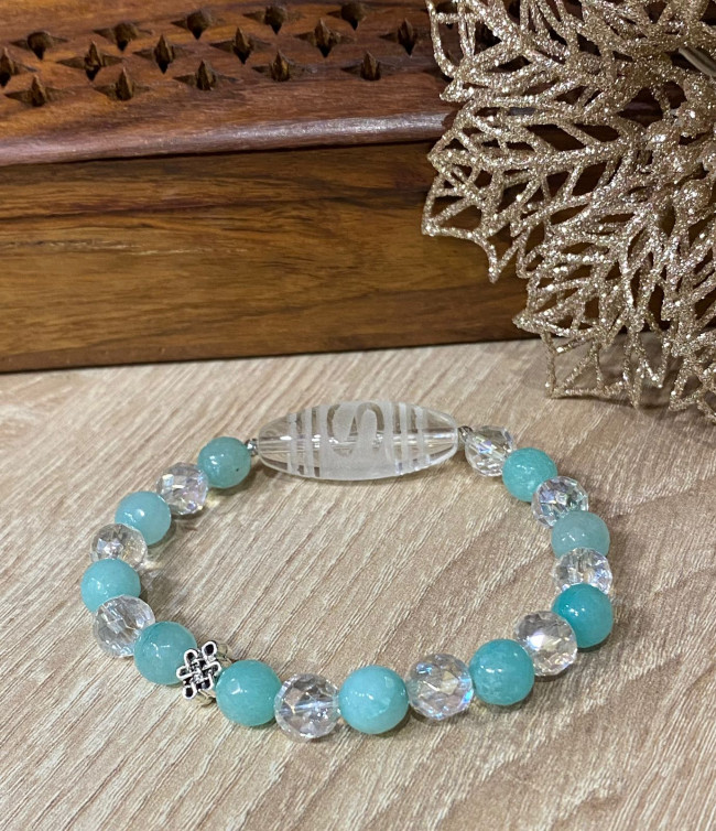 Бусина Дзи "Денежный крючок" в браслете из голубого агата и горного хрусталя Бусина Дзи "Денежный крючок" в браслете из голубого агата и горного хрусталя