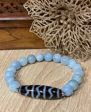 Бусина Дзи "На волне успеха" в браслете из голубого аквамарина Бусина Дзи "На волне успеха" в браслете из голубого аквамарина