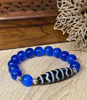 Бусина Дзи " На волне успеха" в браслете из синего кошачьего глаза Бусина Дзи " На волне успеха" в браслете из синего кошачьего глаза