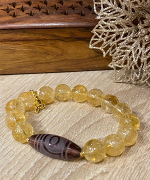 Бусина Дзи 2 глаза в браслете из цитрина с ваджрой
