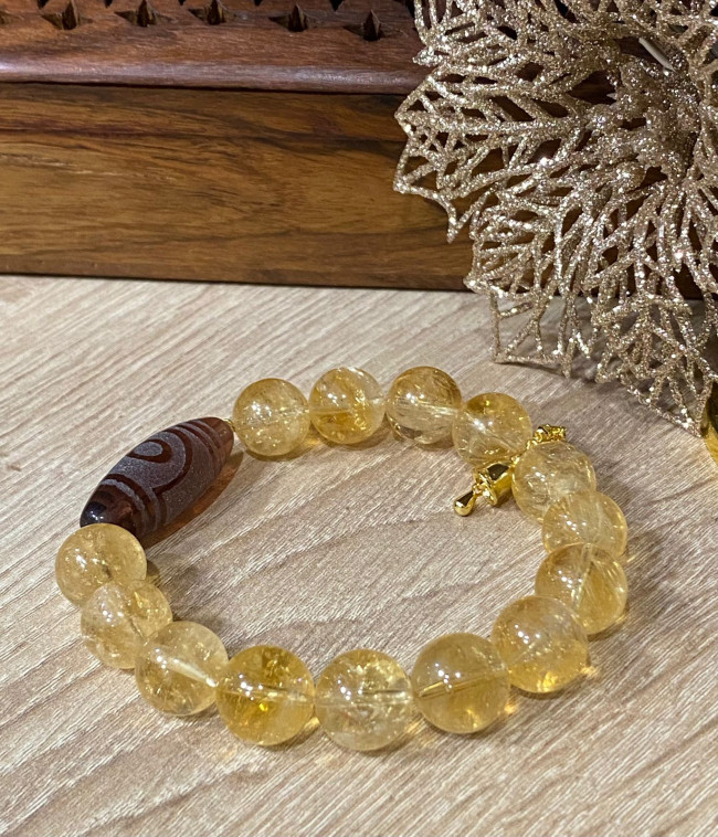 Бусина Дзи 2 глаза в браслете из цитрина с ваджрой