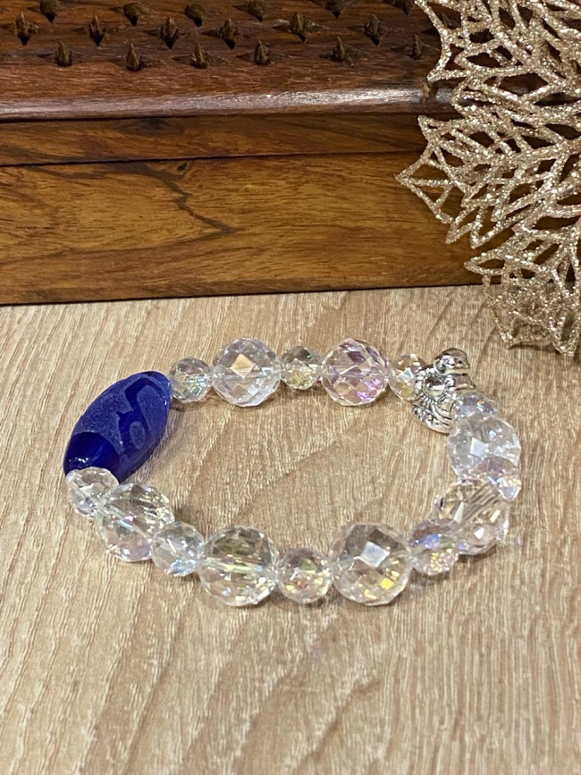 Бусина Дзи "Бог Богатства" в браслете из граненого хрусталя Бусина Дзи "Бог Богатства" в браслете из граненого хрусталя